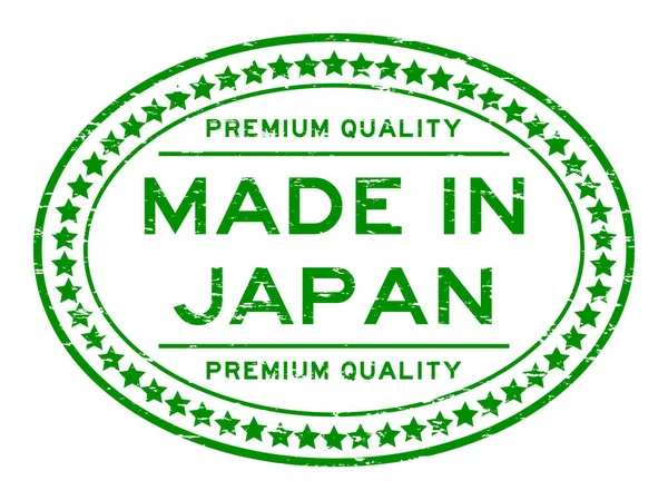 Grunge green premium quality made in Japan with start icon oval rubber stamp — Stock Vector