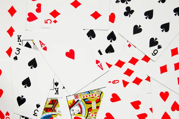 用锹、 心、 俱乐部、 钻石的四种扑克卡背景 — 图库照片