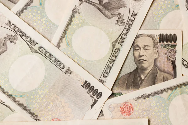 Grupo de billetes de banco japoneses 10000 yen fondo —  Fotos de Stock