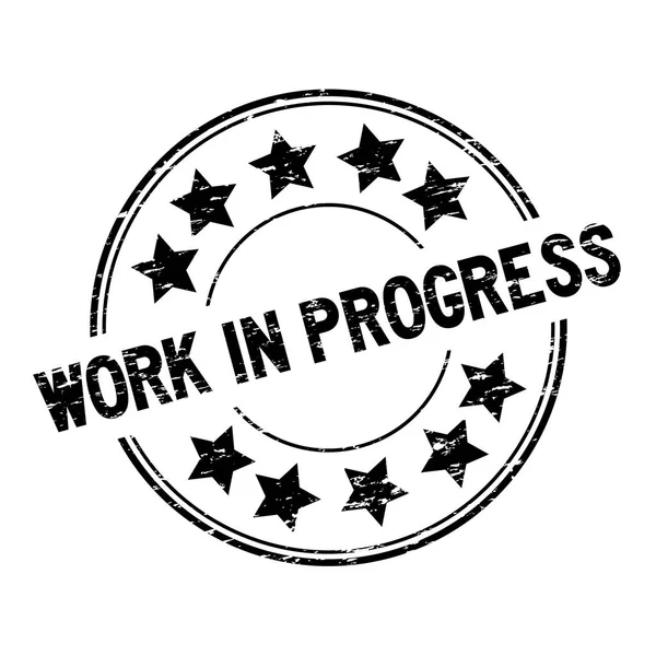 Grunge Black Work in Process mit Star-Symbol runden Gummidichtungsstempel auf weißem Hintergrund — Stockvektor
