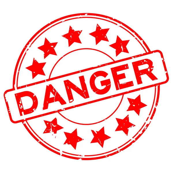 Grunge vermelho perigo formulação com ícone estrela redonda selo de borracha no fundo branco —  Vetores de Stock