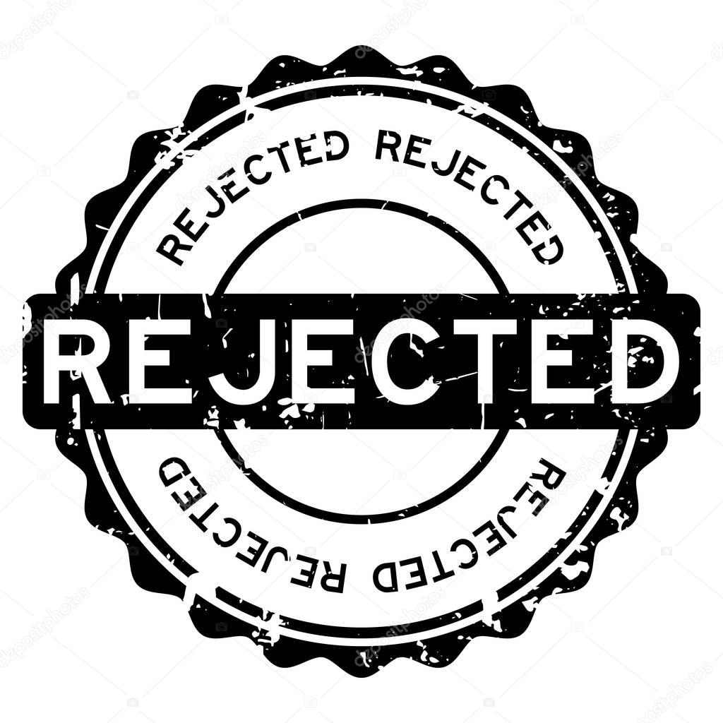 Grunge black rejected round rubber seal stamp on white background