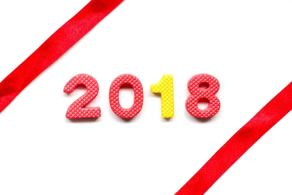 Wording 2018 by toy alphabet with red ribbon on white background — Stock Photo, Image