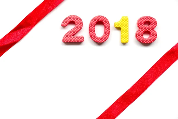 Wording 2018 by toy alphabet with red ribbon on white background — Stock Photo, Image