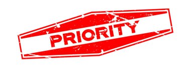 Grunge kırmızı öncelikli ifadeler altıgen lastik mühür damgası beyaz arka plan üzerinde