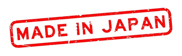 Grunge rouge fabriqué en japonais mot carré cachet en caoutchouc sur fond blanc — Image vectorielle