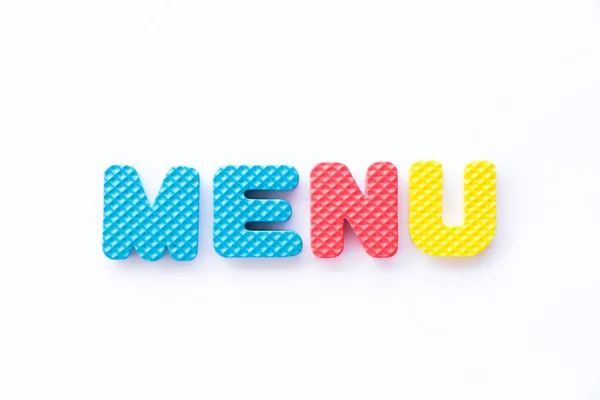 Color toy foam alphabet in word menu on white background — Stock Photo, Image