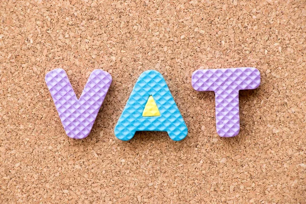 Color toy foam alphabet in word VAT (Abberviation of Value added tax) on cork board background