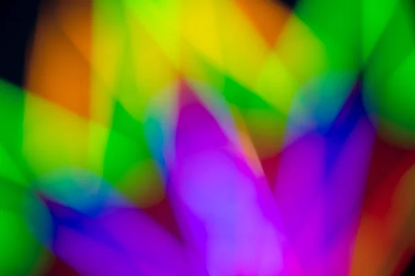 Resumen multicolor de resplandor fluorescente sobre fondo negro — Foto de Stock