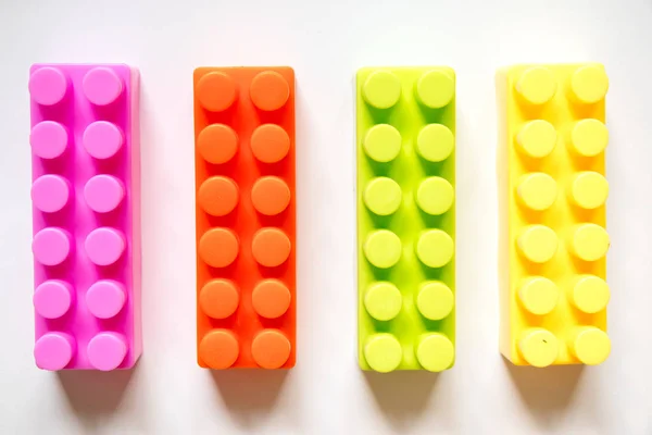 Multi color square plastic toy block on white background — Stock Photo, Image