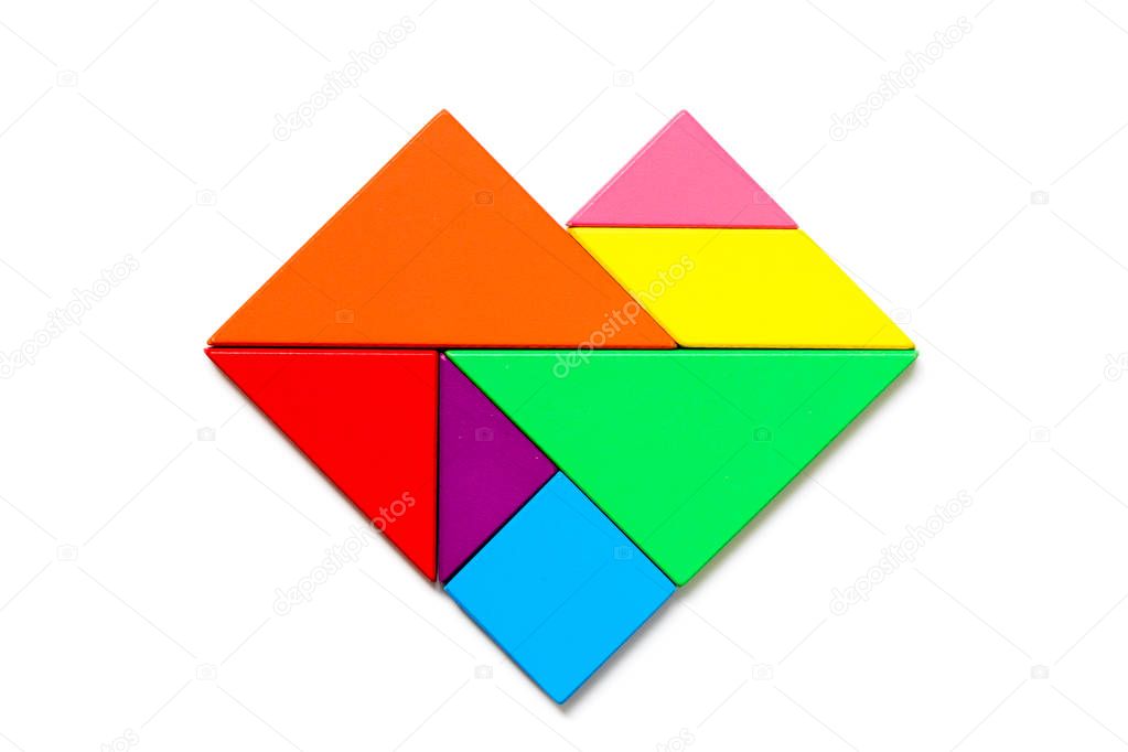 Color wood tangram puzzle in heart shape on white background