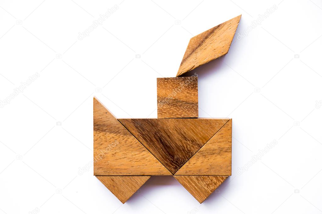 Wood tangram puzzle in train shape on white background