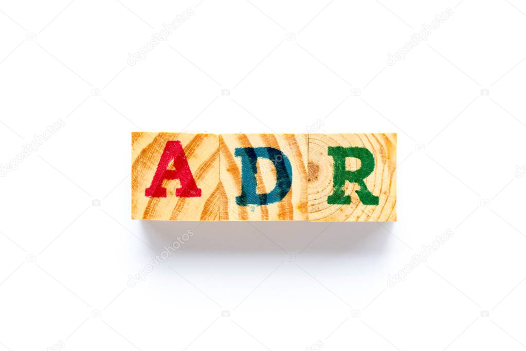 Wood block in word ADR (Abbreviation of adverse drug reaction) on white background
