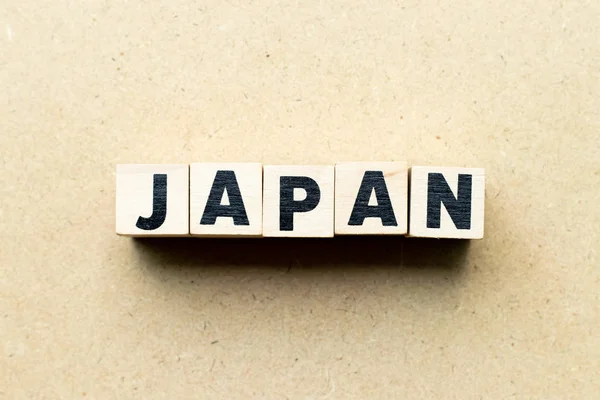 Bloco carta na palavra japão sobre fundo de madeira — Fotografia de Stock