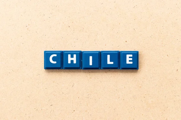 Tile letter in word Chile on wood background — Stock Photo, Image