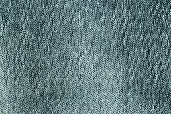 Czarny kolor dżinsy ubrania teksturowane tło — Zdjęcie stockowe
