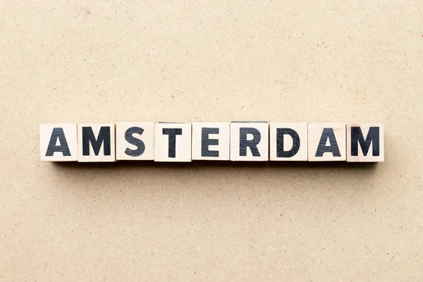 Letter block in word Amsterdam on wood background