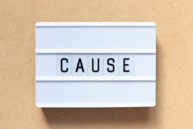 White lightbox with word cause on wood background