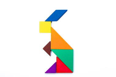 Color wood tangram puzzle in rabbit shape on white background