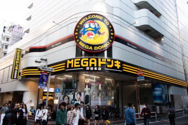 Tokyo, Japan - May 2, 2019 : Unidentified people walk in front of Mega Don Quitjote Shibuya Honten.
