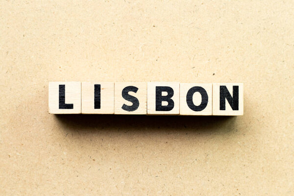 Letter block in word Lisbon on wood background
