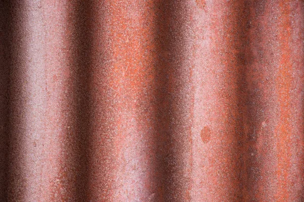 Grunge red corrugated iron metal plate textured background