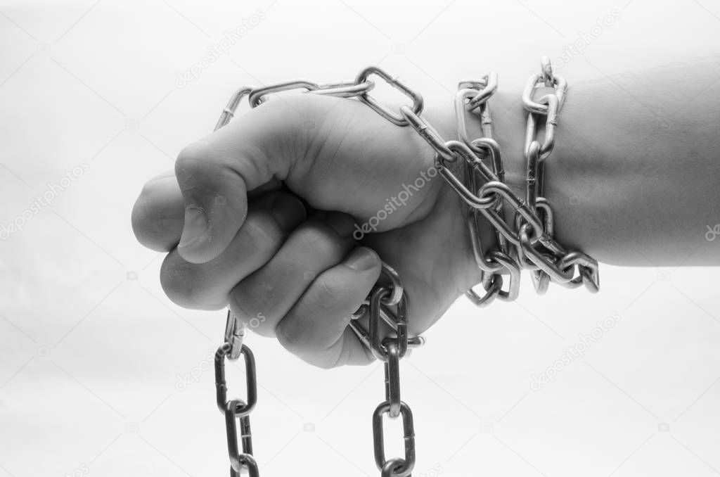 Hands are chained in chains isolated on white background