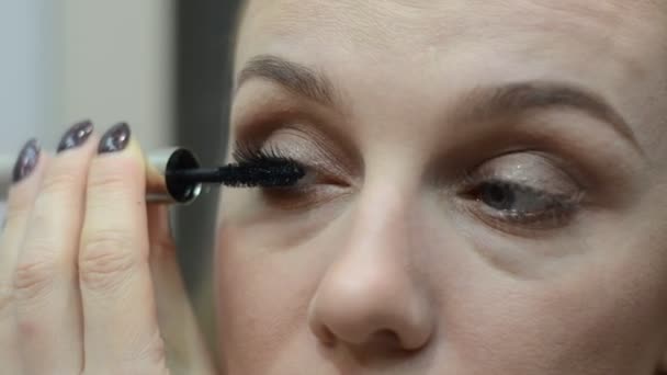 Young Woman Paints Eyebrows Mirror — Stock Video