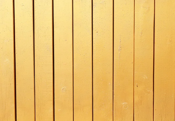 Golden texture on wooden background