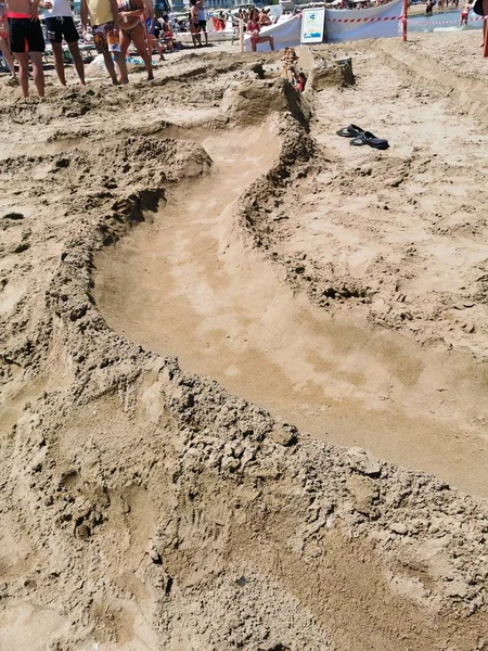 Spoor voor knikkers op het zand van riccione strand — Stockfoto