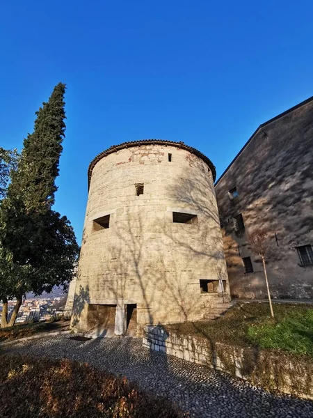 defense tower on the walls of the castle of Brescia at sunset