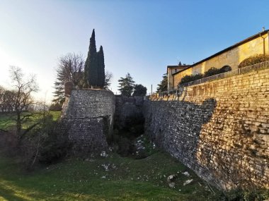 Brescia Castle, protective walls and tower in a beautiful sunny day