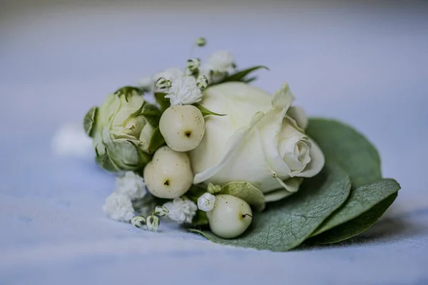 small isolated groom bouquet with white roses