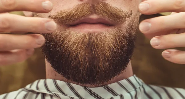 Closeup of a cropped photo of a bearded stylish men. Care beard and mustache in beauty salon. — Stock Photo, Image