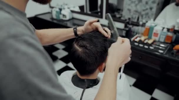 Haircut and beard haircut in barbershop. — Stock Video