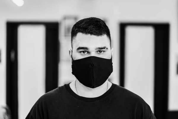 Male black and white portrait. A man in a black mask. — Stock Photo, Image