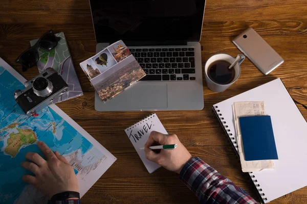 planning travel map tea laptop map on the desk