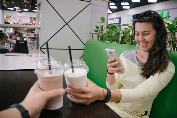 First-person view on woman taking picture of smoothie — Stock Photo, Image