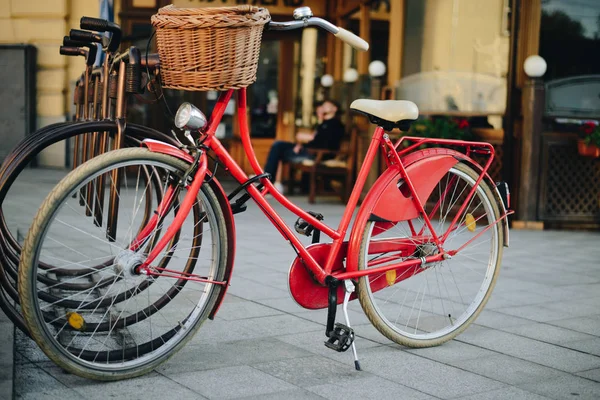 Old retro bike with basket in stand on bike park in the city — Stock Photo, Image