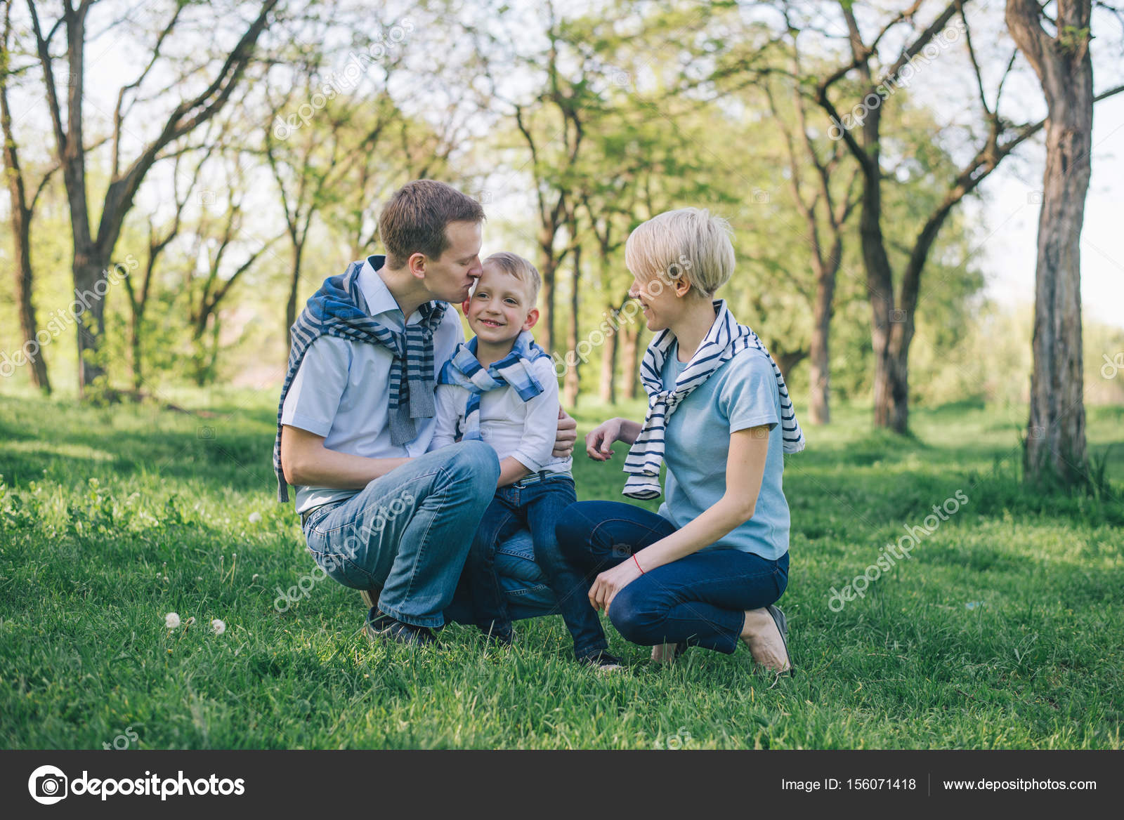 Portrait of family in park — Stock Photo © Vera_Petrunina #156071418