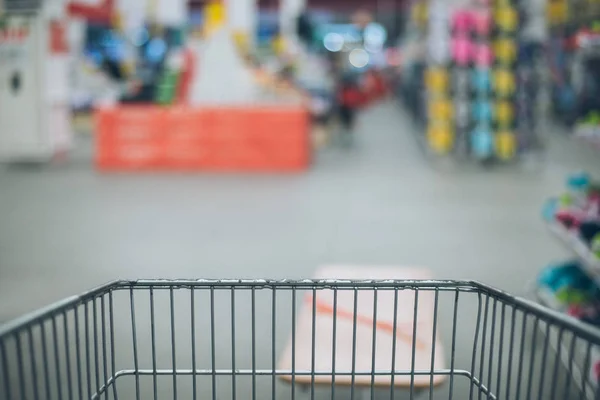 View from the cart on blured store — Stock Photo, Image