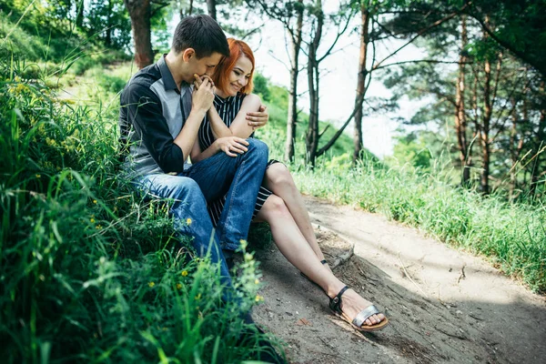 Portrait of beautiful young pair in a park — Stock Photo, Image