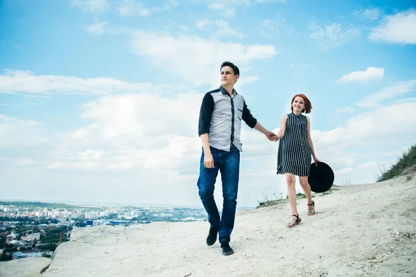 Man walking with woman on the top of the hill — Stock Photo, Image