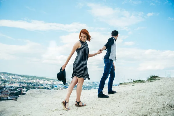 Man walking with woman on the top of the hill — Stock Photo, Image