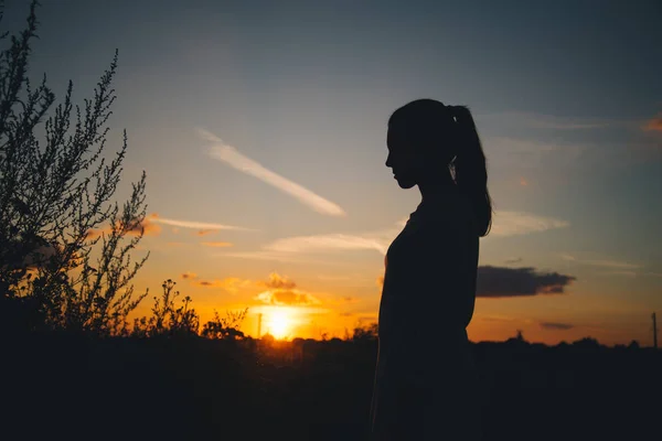 Silhouette of a woman with evening sky — Stock Photo, Image