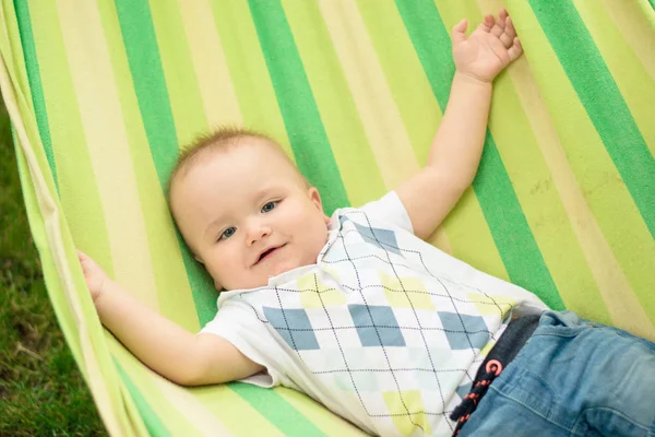 Baby laughing in hammock — Stock Photo, Image