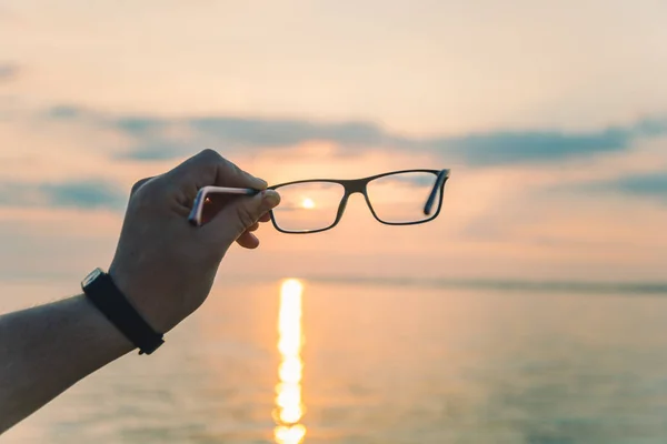 Sunrise through eyeglasses — Stock Photo, Image