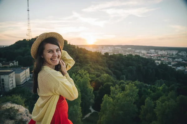 Happy woman stands on the top of the hill — Stock Photo, Image