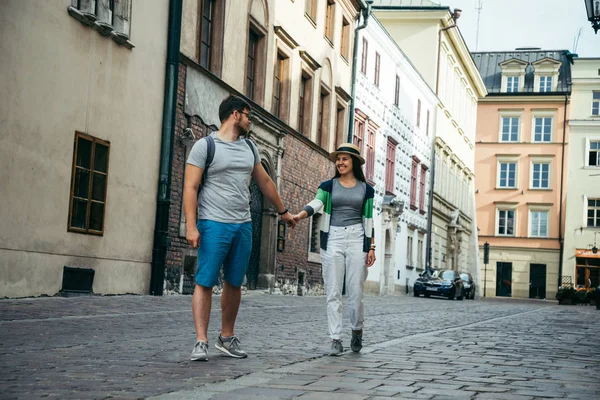 Woman follow man outside at old europian street — Stock Photo, Image