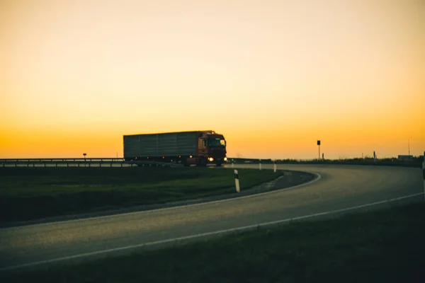 truck on highway on sunset